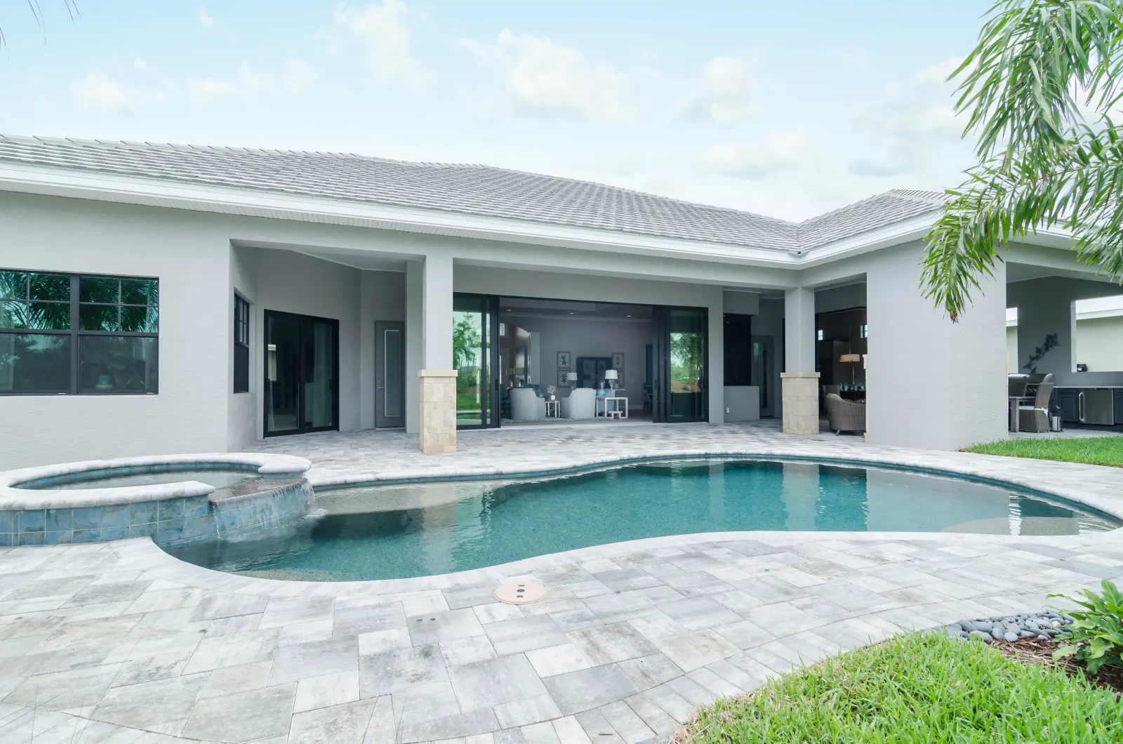 Exterior front at The Captiva Model, a custom home built by Marvin Homes in Naples, Florida