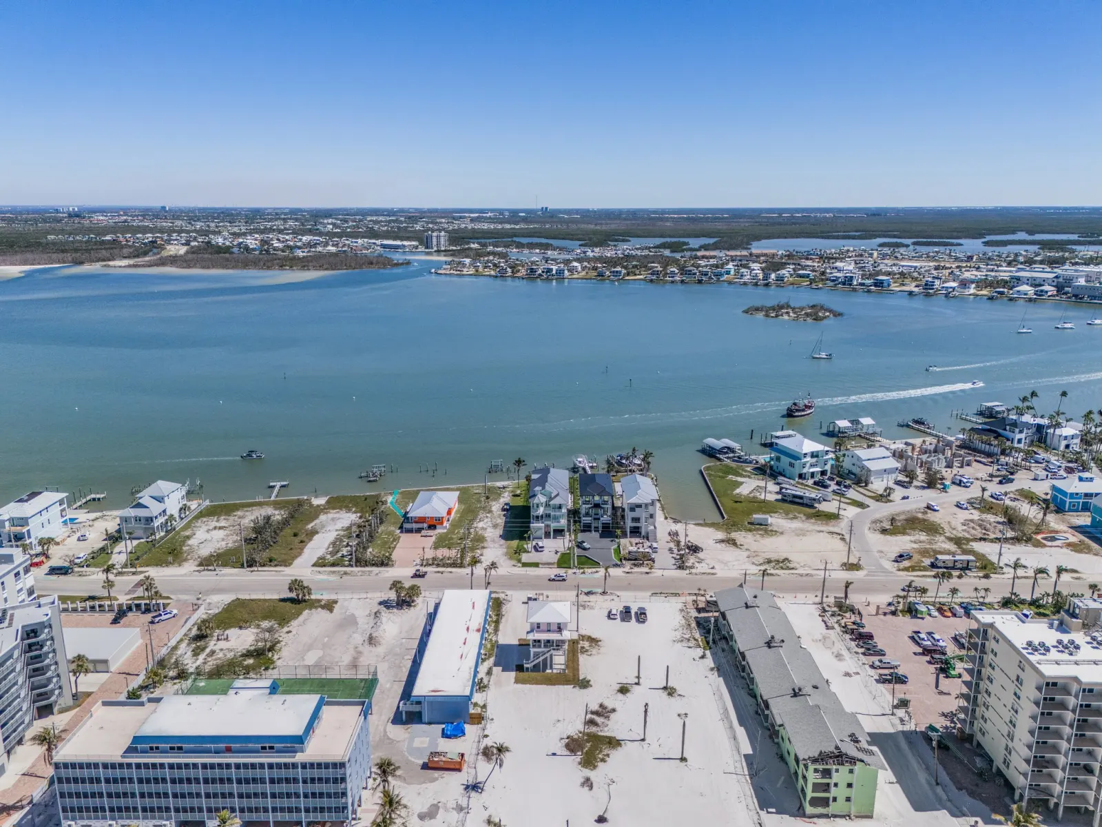 Aerial view of canal-front homes and docks in Lee County, Florida