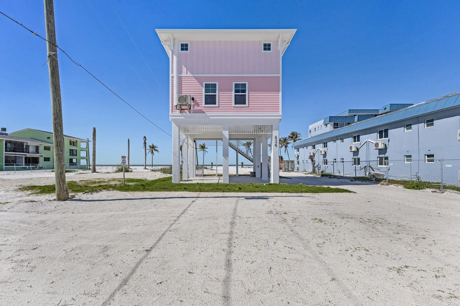Exterior front at The Flamingo, a custom home built by Marvin Homes in Fort Myers Beach, Florida