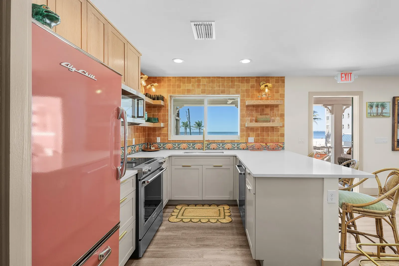 Kitchen hallway exit at The Flamingo, a custom home built by Marvin Homes in Fort Myers Beach, Florida