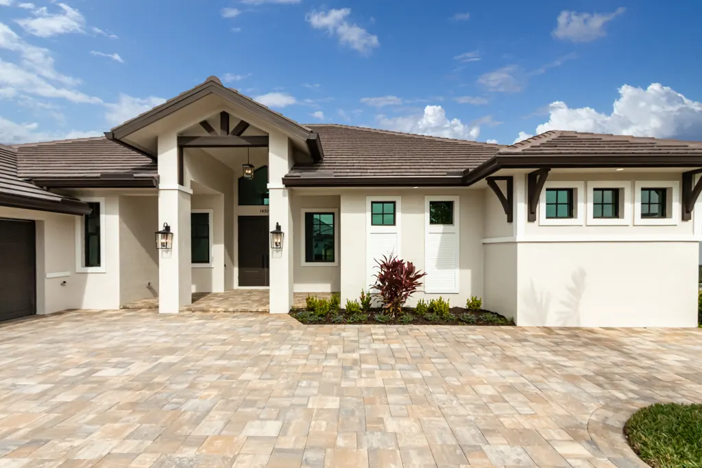 Exterior entry portico at The Heron House, a custom home built by Marvin Homes in Naples, Florida
