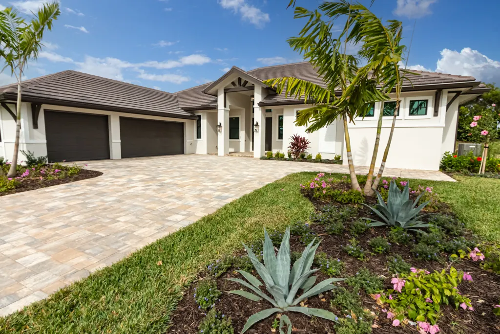 Exterior front agave at The Heron House, a custom home built by Marvin Homes in Naples, Florida
