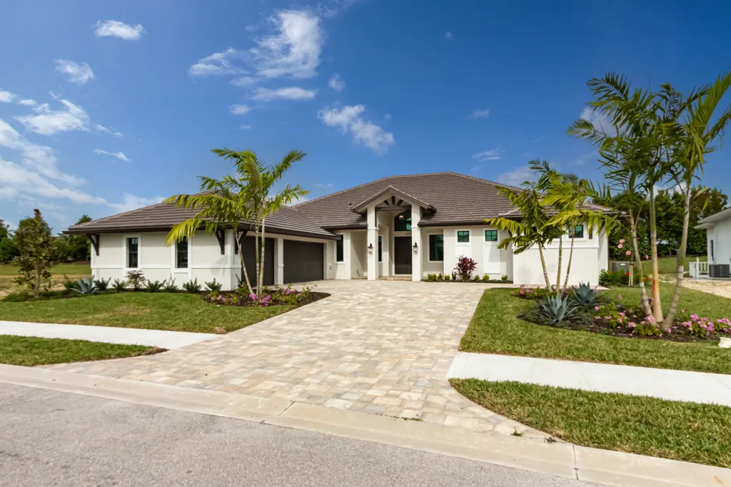 Exterior front angle at The Heron House, a custom home built by Marvin Homes in Naples, Florida