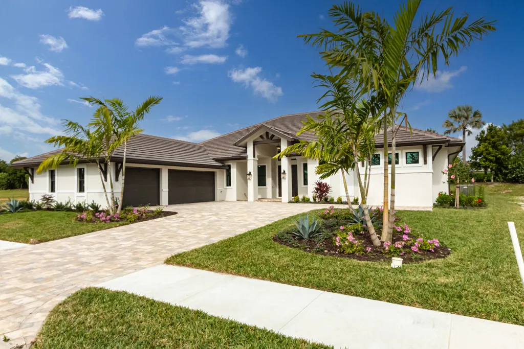 Exterior front angle at The Heron House, a custom home built by Marvin Homes in Naples, Florida