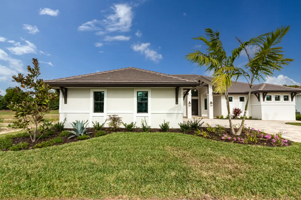 Exterior front side wing at The Heron House, a custom home built by Marvin Homes in Naples, Florida