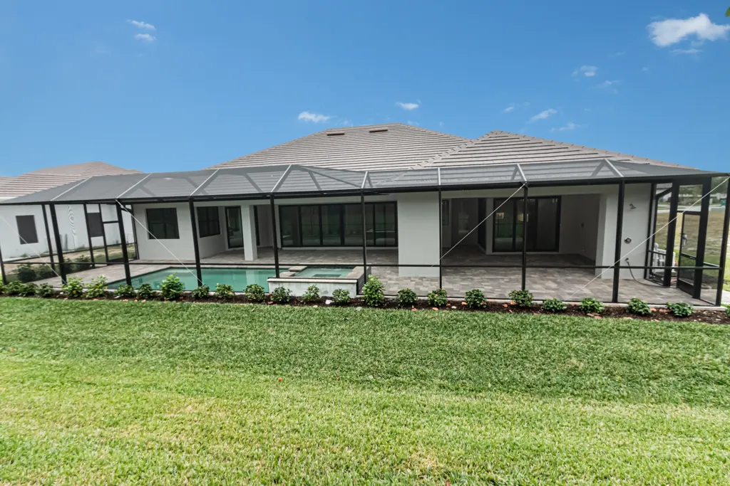 Exterior rear elevation at The Heron House, a custom home built by Marvin Homes in Naples, Florida