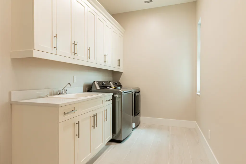 Laundry room at The Heron House, a custom home built by Marvin Homes in Naples, Florida