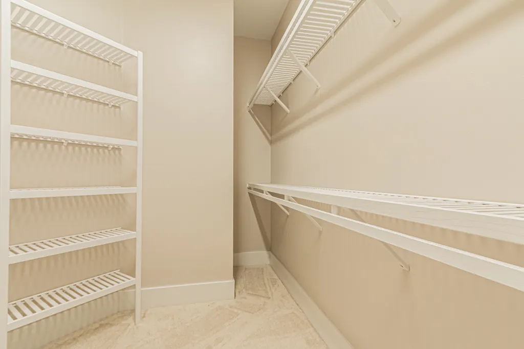 Walk in closet at The Heron House, a custom home built by Marvin Homes in Naples, Florida