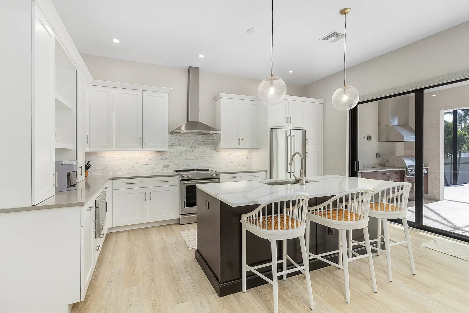 Kitchen outdoor view at The Ibis, a custom home built by Marvin Homes in Cape Coral, Florida