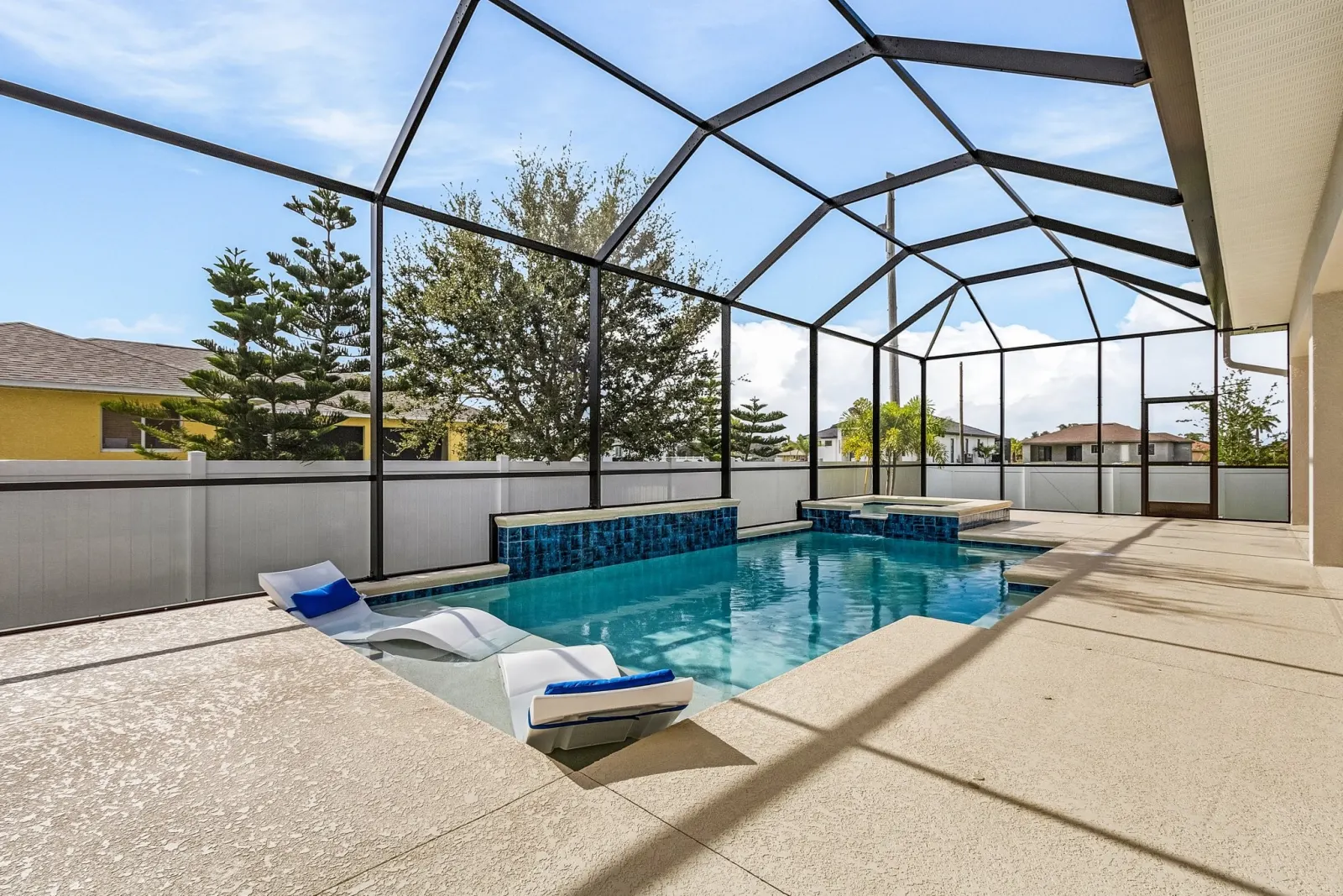 Pool loungers at The Ibis, a custom home built by Marvin Homes in Cape Coral, Florida