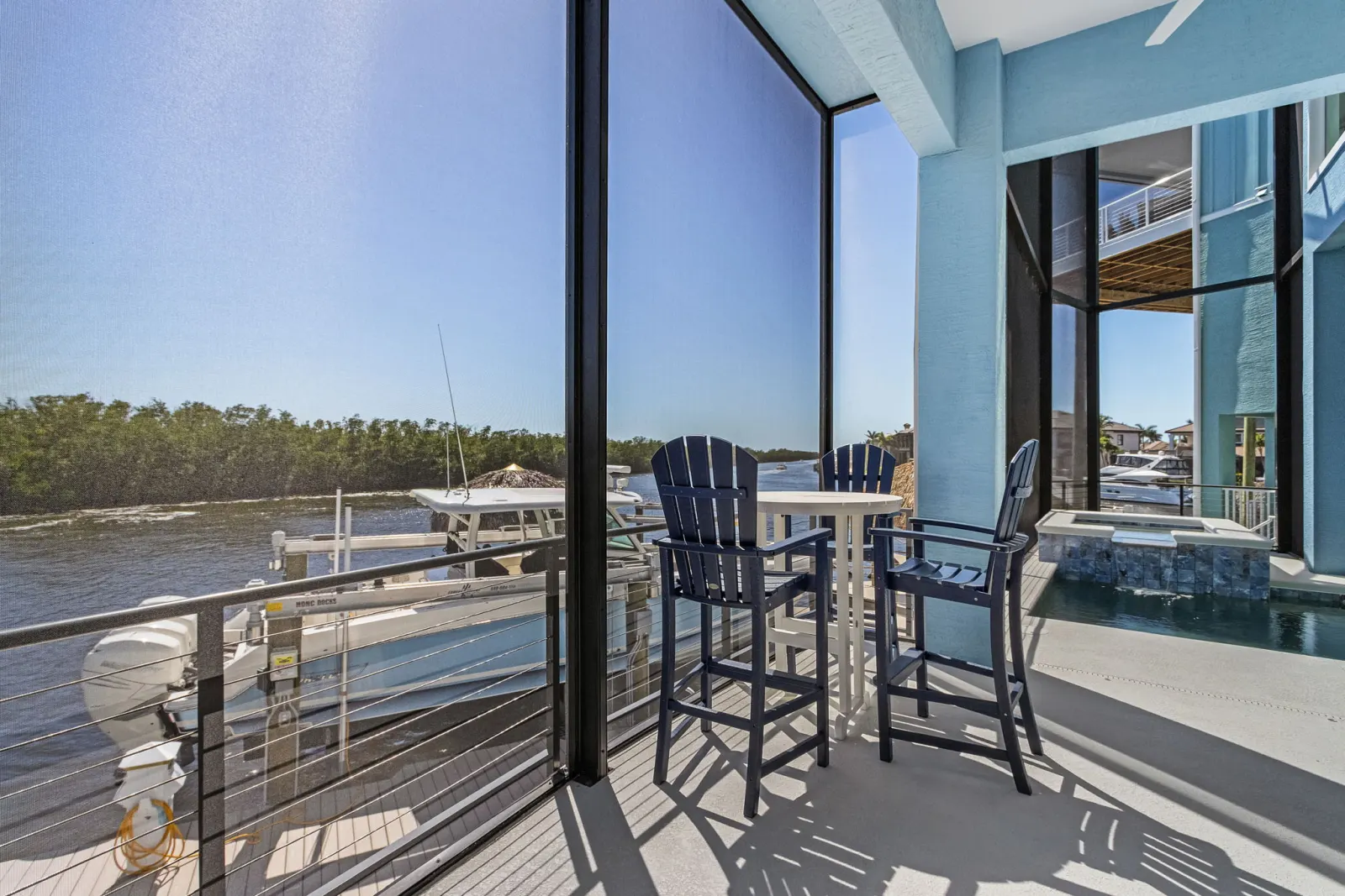 Balcony bar seating at The Marlin, a custom home built by Marvin Homes in Cape Coral, Florida