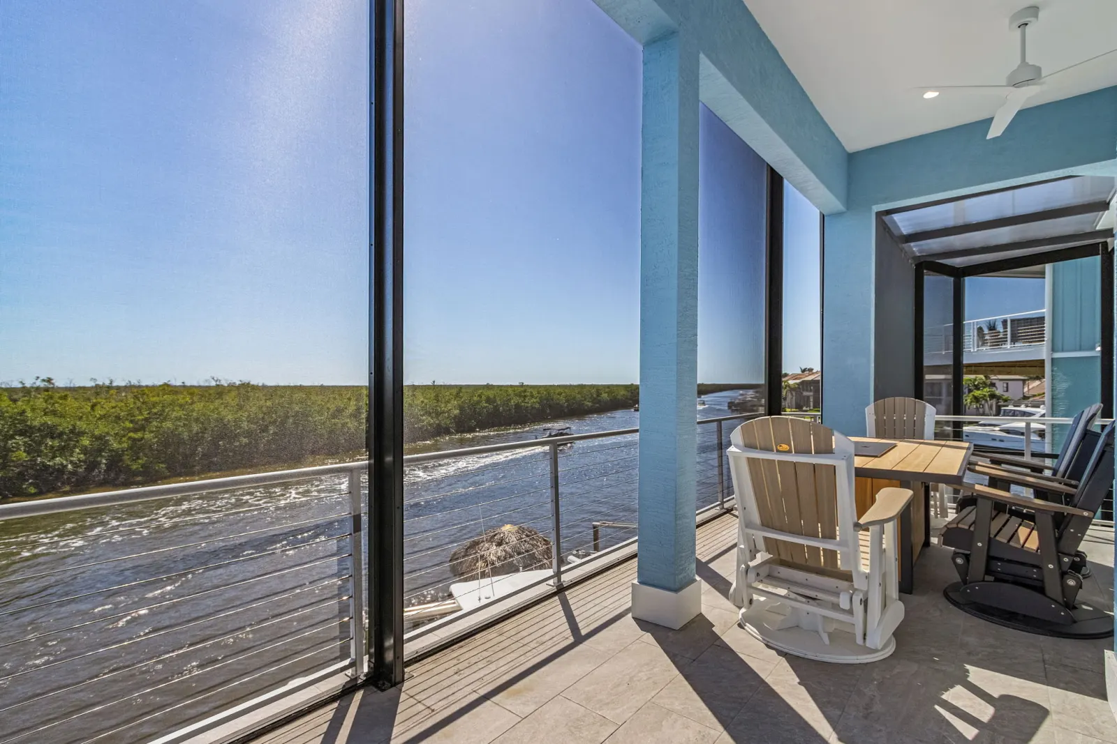 Balcony corner canal view at The Marlin, a custom home built by Marvin Homes in Cape Coral, Florida