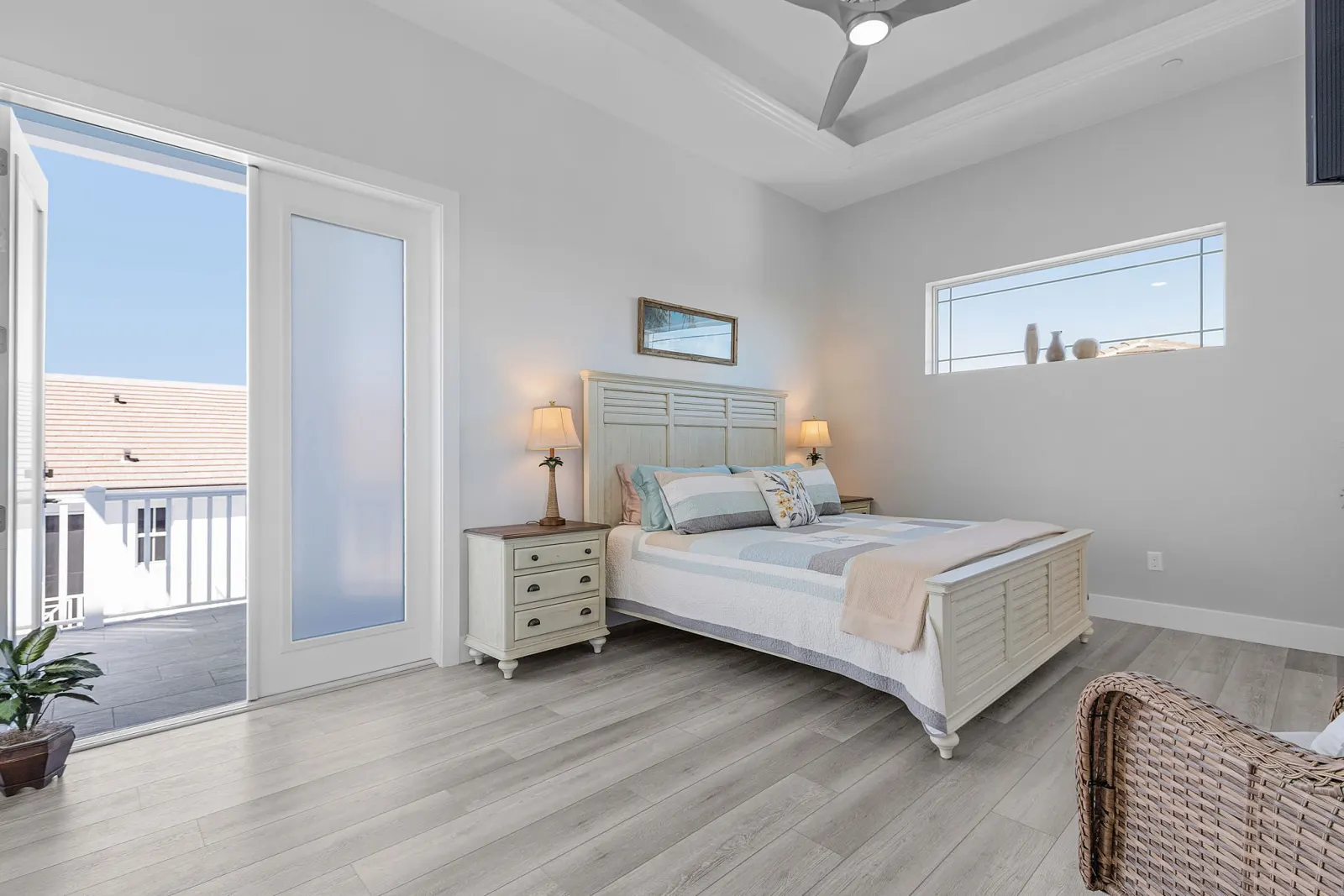 Bedroom guest balcony access at The Marlin, a custom home built by Marvin Homes in Cape Coral, Florida