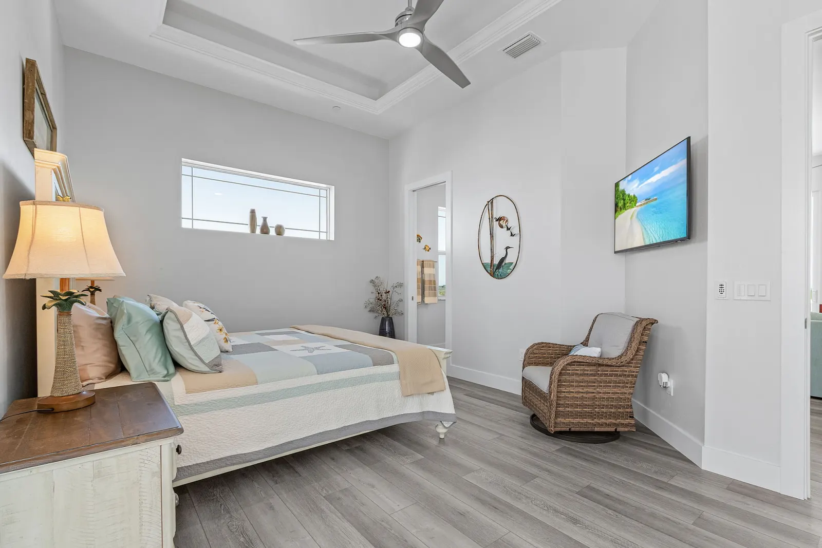 Bedroom guest heron art at The Marlin, a custom home built by Marvin Homes in Cape Coral, Florida