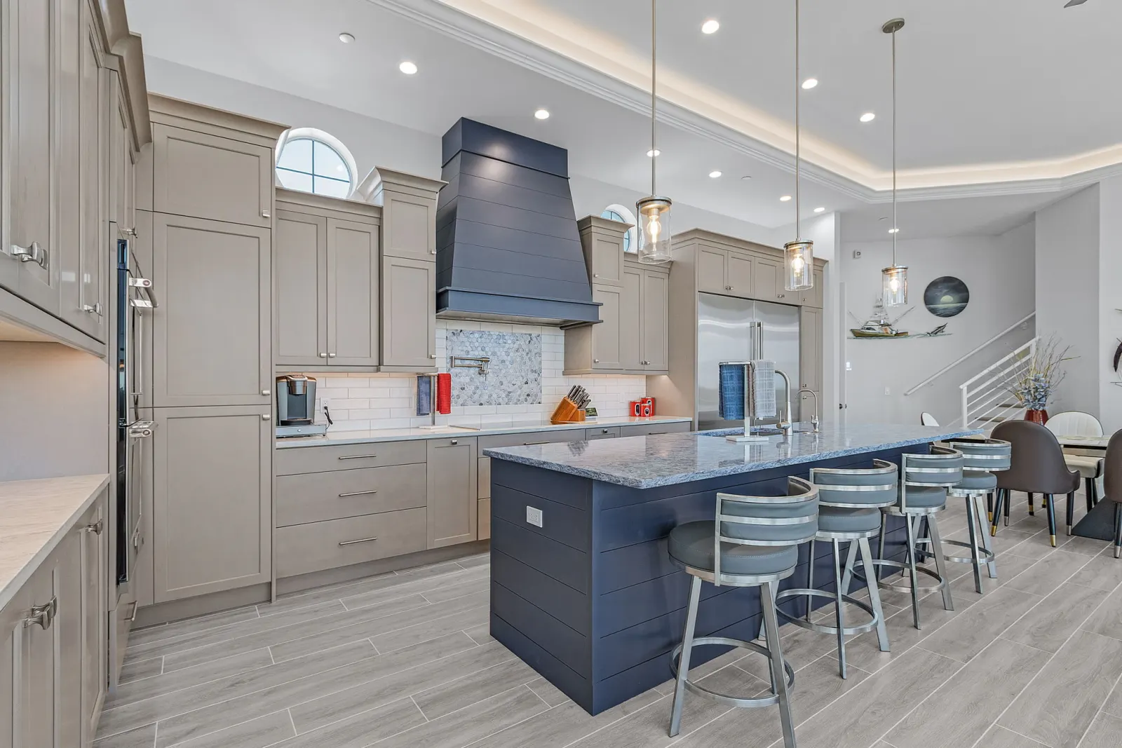 Marlin kitchen island bar seating — custom home built by Marvin Homes in Southwest Florida