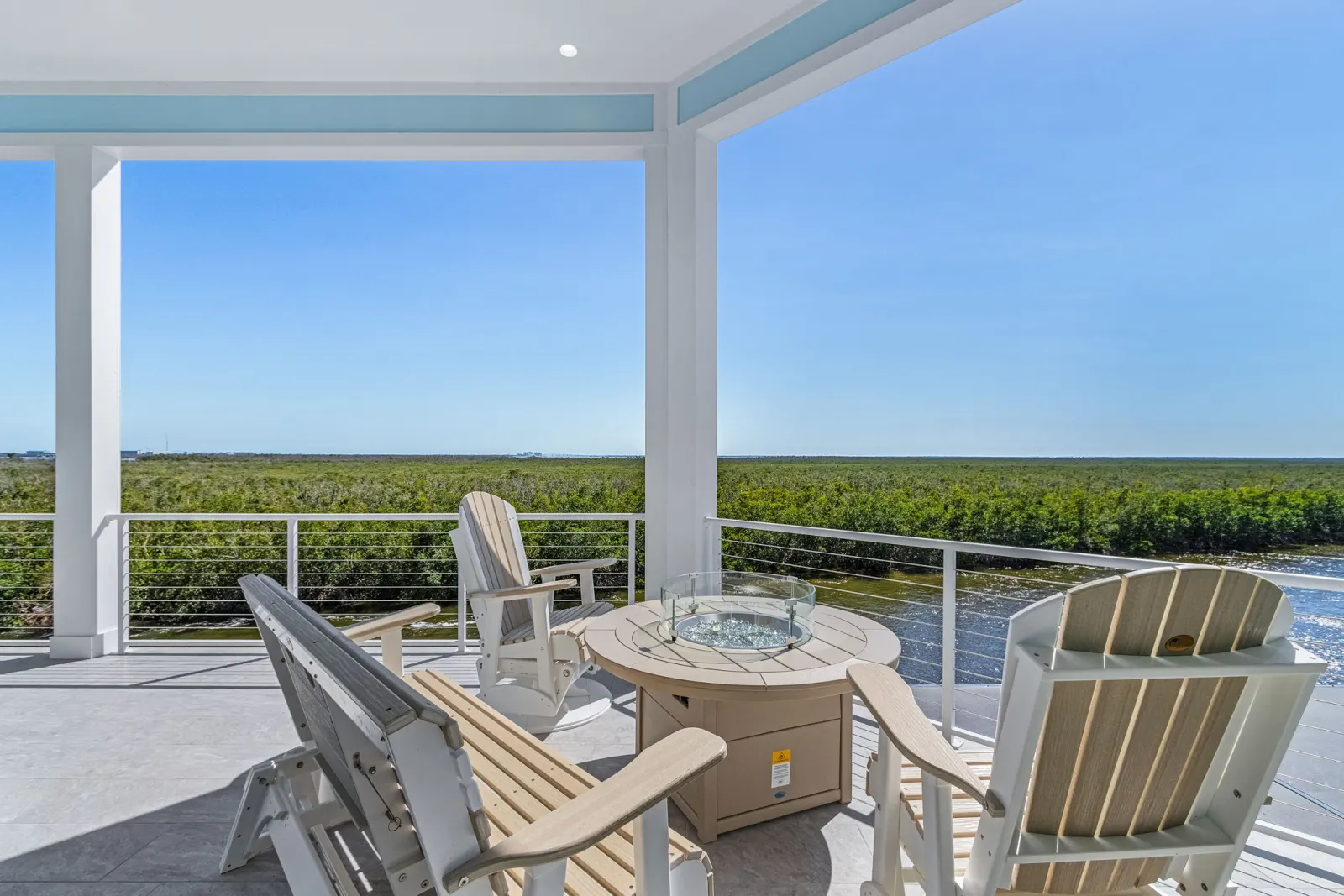 Rooftop deck firepit horizon view at The Marlin, a custom home built by Marvin Homes in Cape Coral, Florida