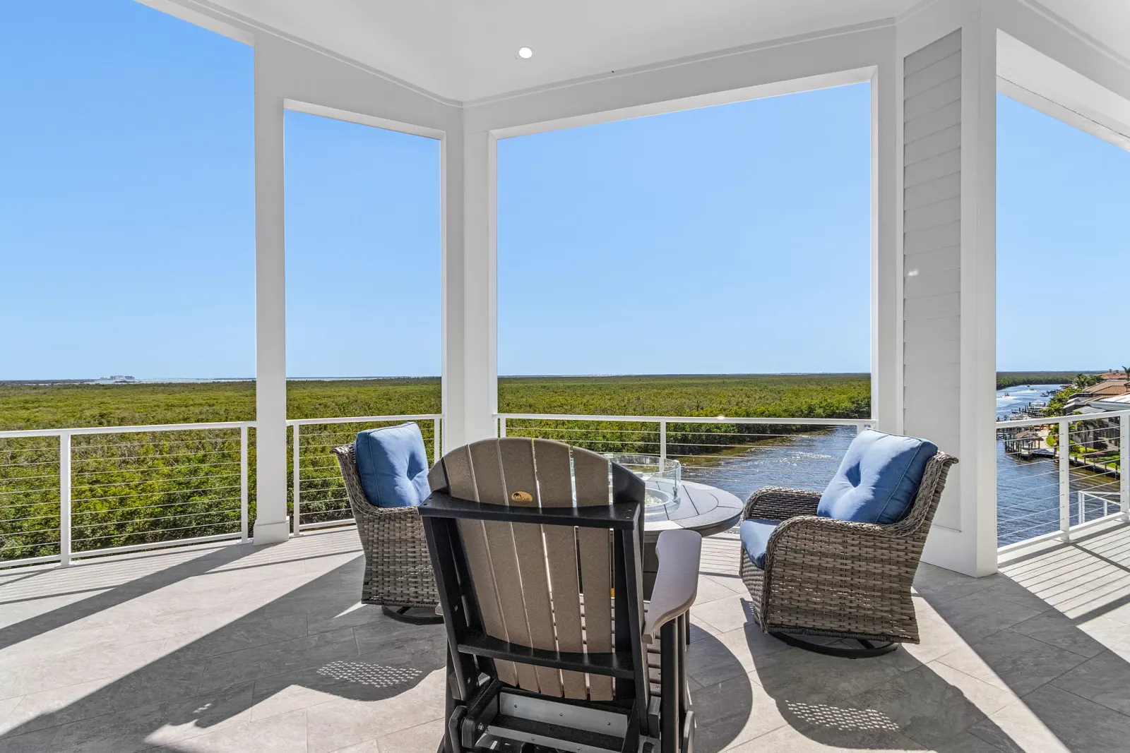 Rooftop deck firepit mangrove view at The Marlin, a custom home built by Marvin Homes in Cape Coral, Florida