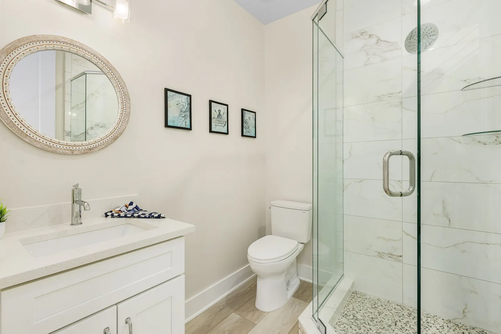 Bathroom octopus art prints at The Octopus, a custom home built by Marvin Homes in Cape Coral, Florida