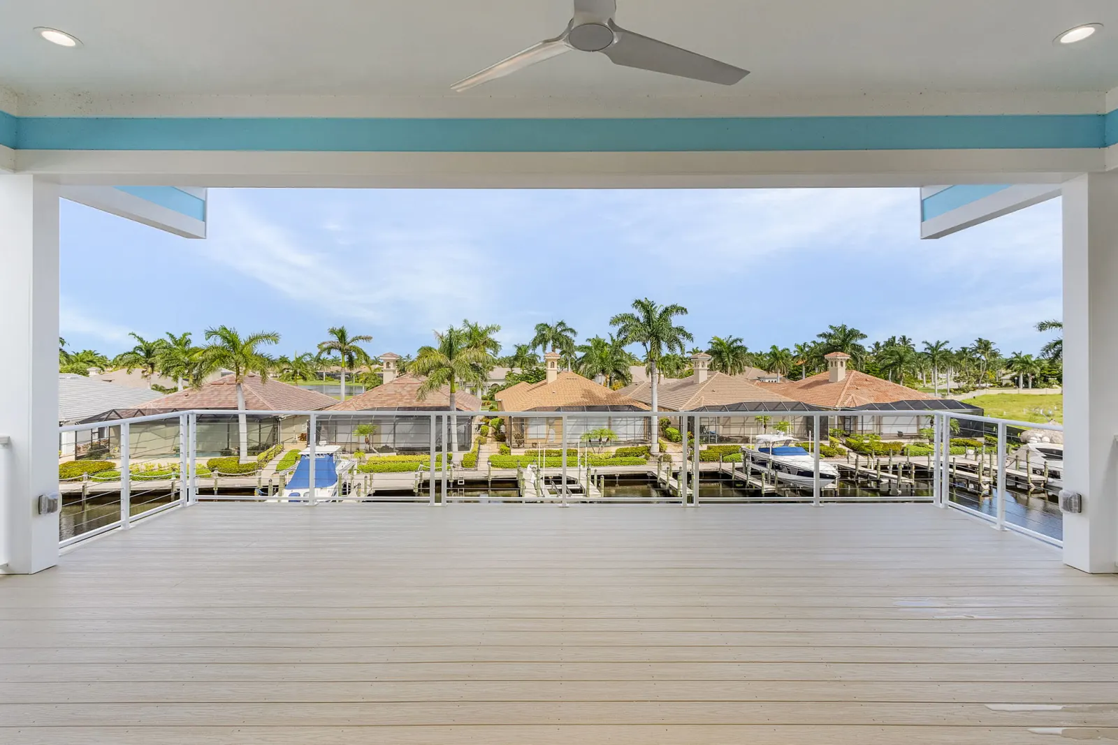 Deck view canal boats at The Octopus, a custom home built by Marvin Homes in Cape Coral, Florida