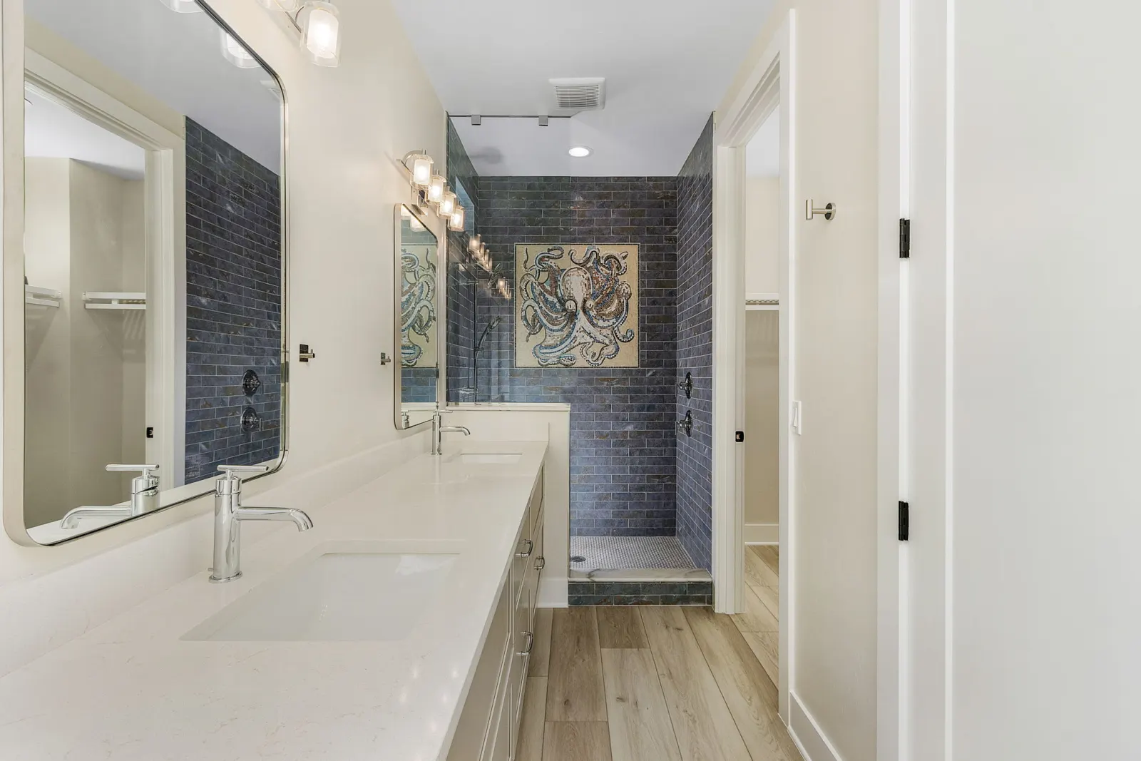 Primary bathroom octopus mosaic at The Octopus, a custom home built by Marvin Homes in Cape Coral, Florida