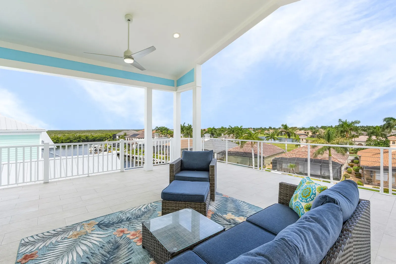 Rooftop deck lounge canal view at The Octopus, a custom home built by Marvin Homes in Cape Coral, Florida