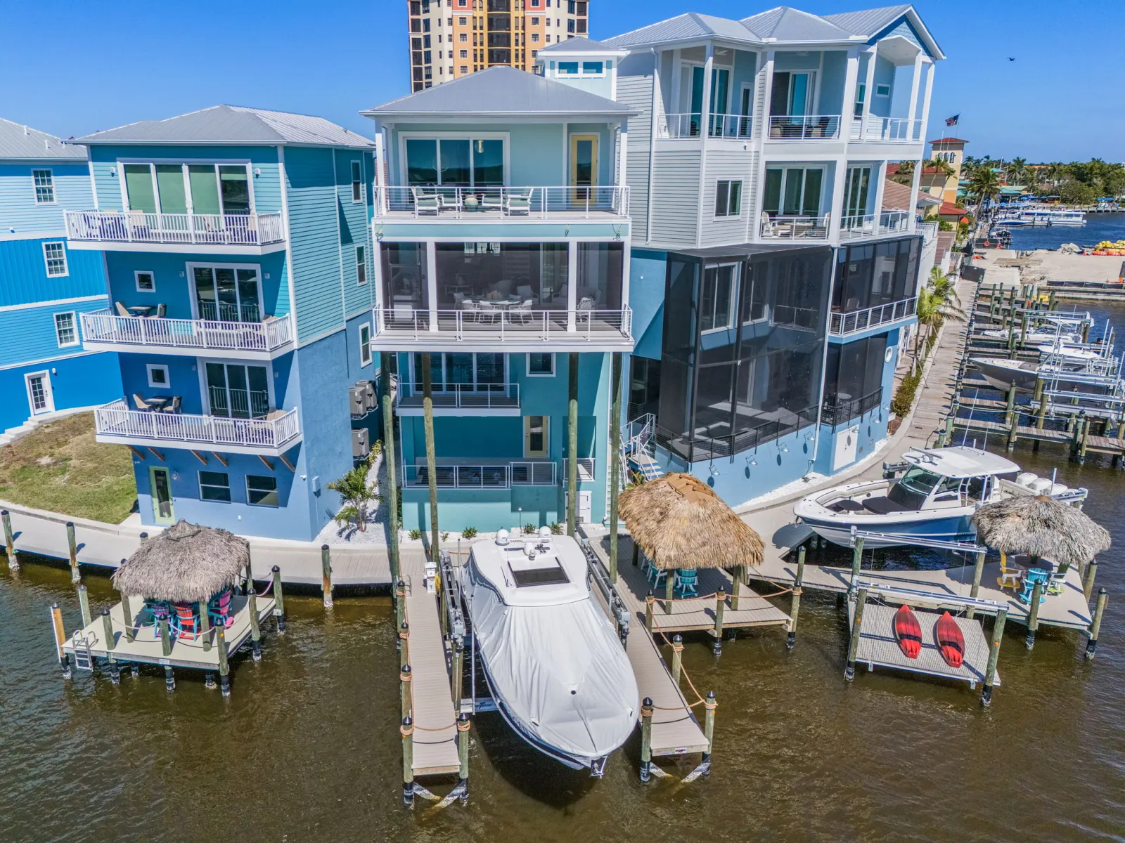 Aerial rear balconies screened porches at Pelican's Perch, a custom home built by Marvin Homes in Cape Coral, Florida