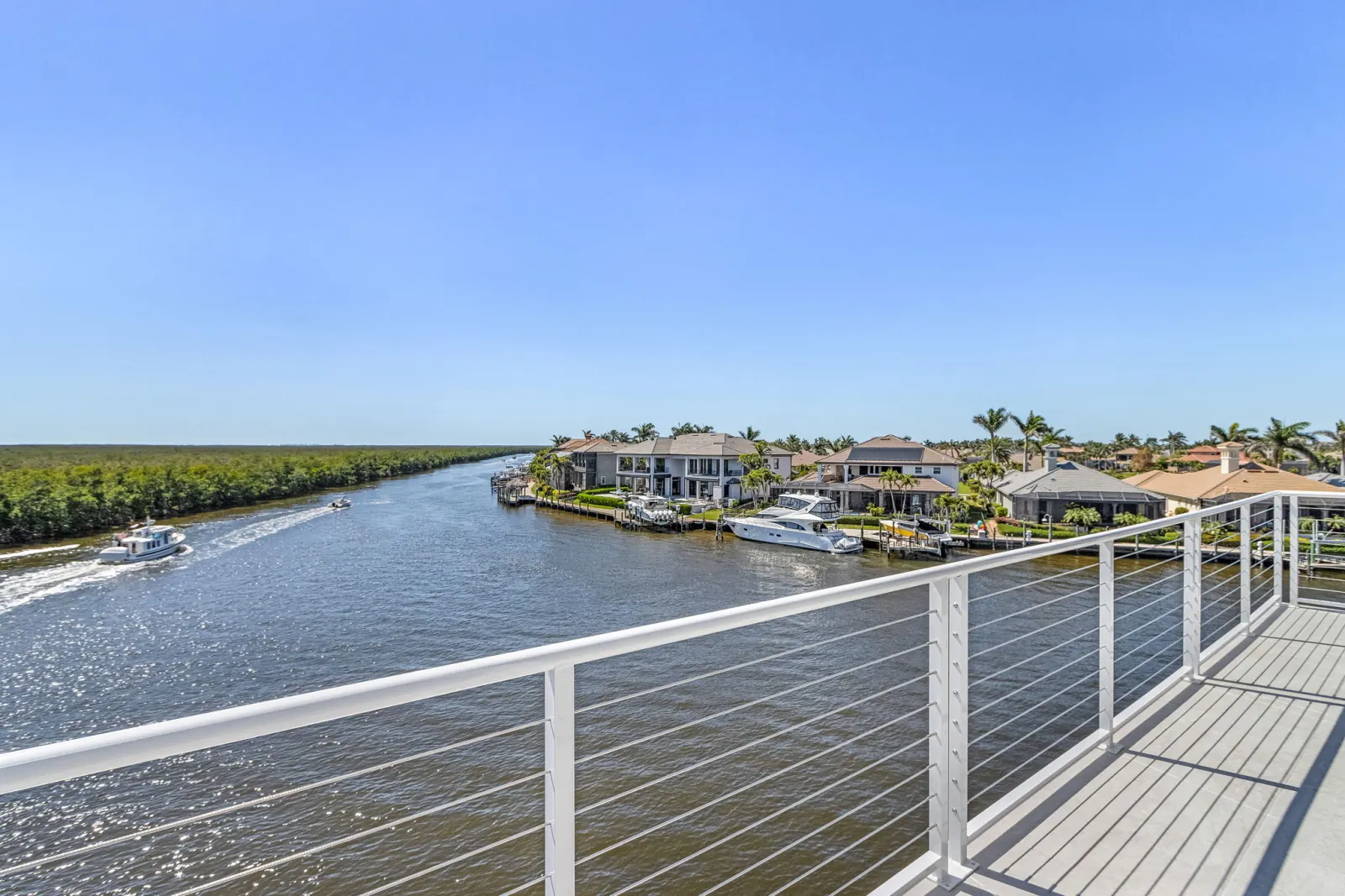 Balcony railing canal view at Pelican's Perch, a custom home built by Marvin Homes in Cape Coral, Florida