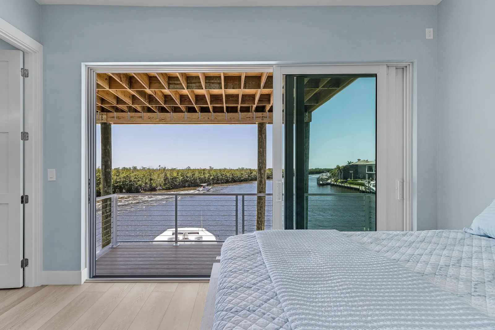 Bedroom blue deck view at Pelican's Perch, a custom home built by Marvin Homes in Cape Coral, Florida