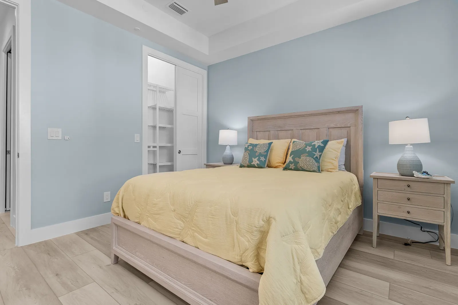 Bedroom yellow turtle closet at Pelican's Perch, a custom home built by Marvin Homes in Cape Coral, Florida