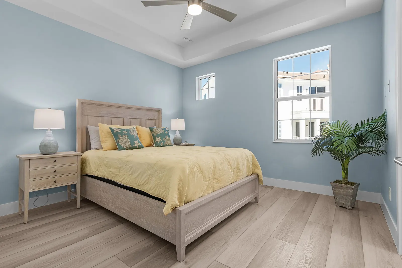 Bedroom yellow turtle window at Pelican's Perch, a custom home built by Marvin Homes in Cape Coral, Florida