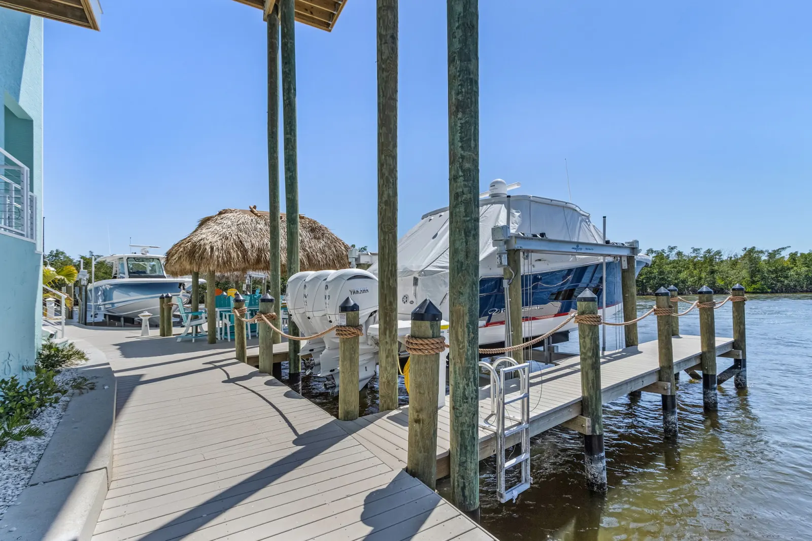 Dock boat lift at Pelican's Perch, a custom home built by Marvin Homes in Cape Coral, Florida