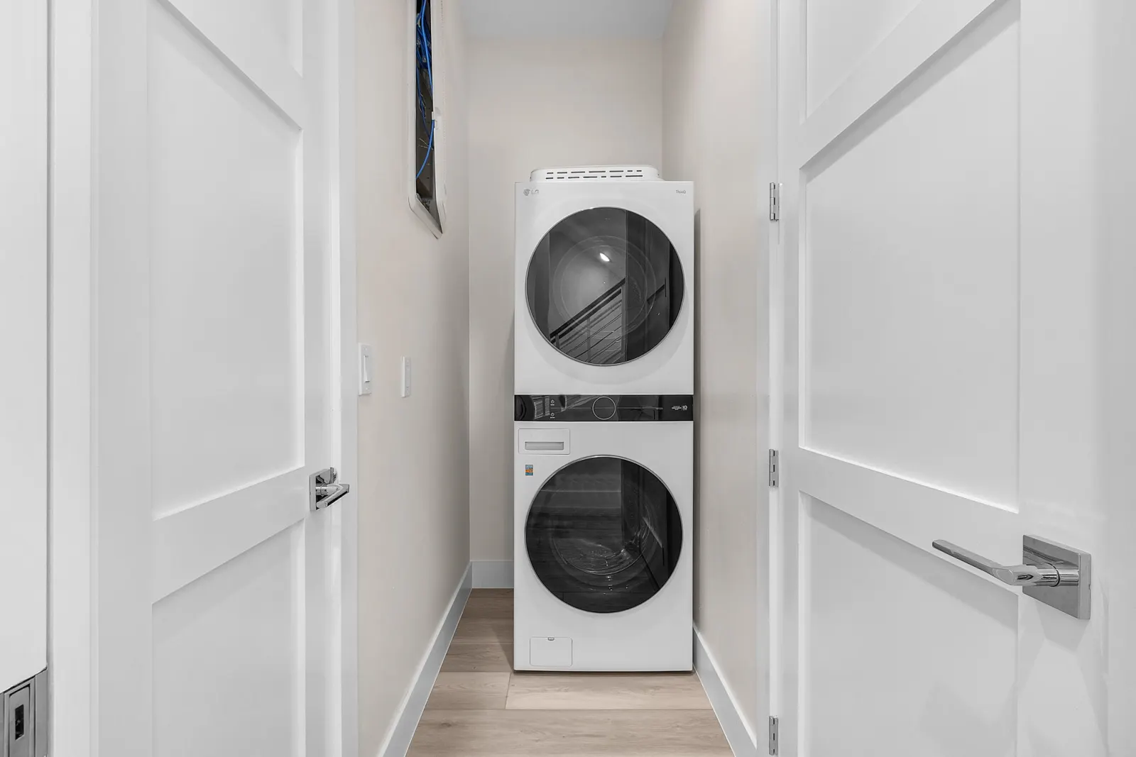 Laundry stacked washer dryer at Pelican's Perch, a custom home built by Marvin Homes in Cape Coral, Florida