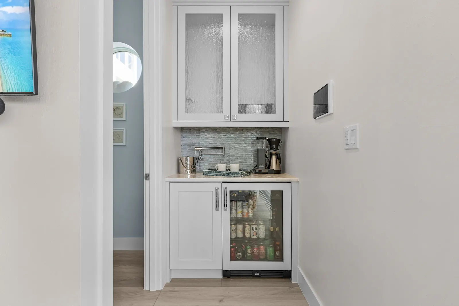 Wet bar coffee station at Pelican's Perch, a custom home built by Marvin Homes in Cape Coral, Florida